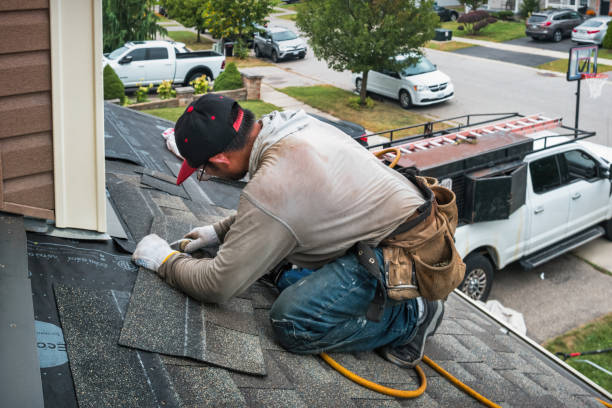 Professional Roof Replacement technician working in Roland, OK